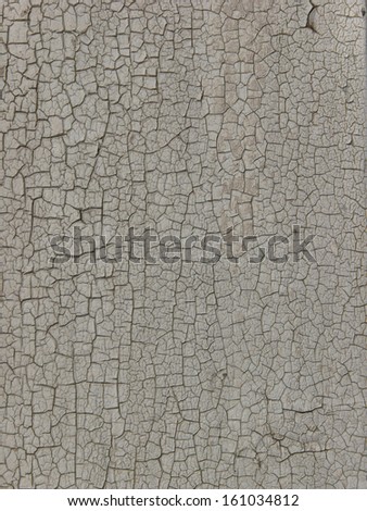 Old wood texture covered with cracking white paint, with patches of brown wood visible underneath.