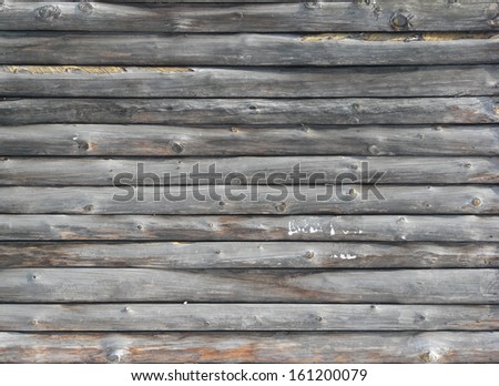 Grey planks with rounded edges set in horizontal fashion.
