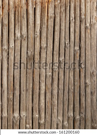 Old grey planks with rounded and splintering edges.