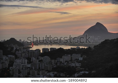 Sunset over Lagoon, which is the famous inland water connected atlantic Ocean, mecca for aquatic sports such as rowing. Surrounding is known for the wealthy residential area in Rio de Janeiro, Brazil