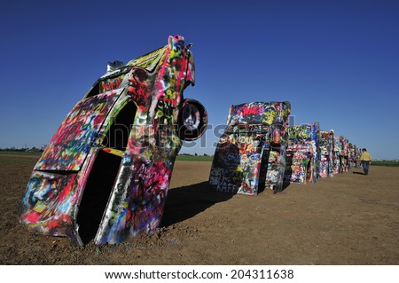 AMARILLO, TEXAS, USA,  - March. 27. 2012 : Cadillac near Amarillo, public art installation and sculpture in Amarillo, Texas, U.S. with ten Cadillac buried in a farm field near Rt. 66.