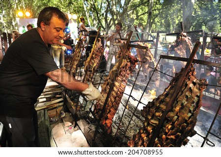 Mendoza, Argentina, - March. 2. 2014: Asado, Argentine barbecue, national dish, grilled with charcoal