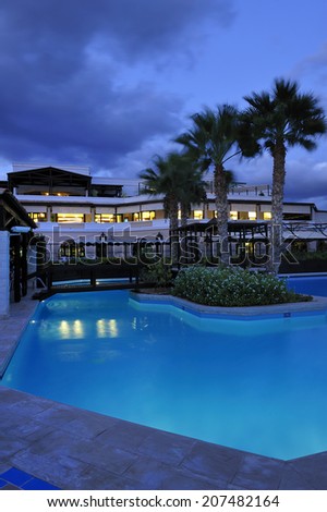 swimming pool in night illumination at the modern luxury hotel, Crete, Greece