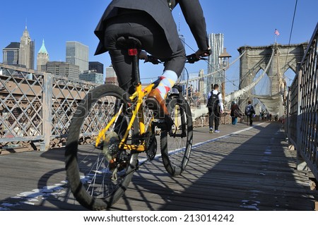 New York City, USA, - May. 19. 2014: Bike riders commuting to Manhattan over Brooklyn Bridge. New York, USA