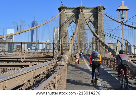 New York City, USA, - May. 19. 2014: Bike riders commuting to Manhattan over Brooklyn Bridge. New York, USA