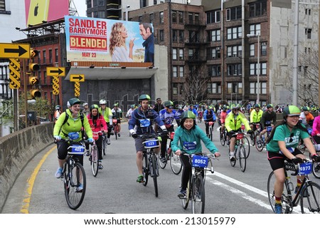 New York City, USA, - May. 4. 2014: people going up Queensboro  Bridge at Five Boro Bike Tour, New York, USA