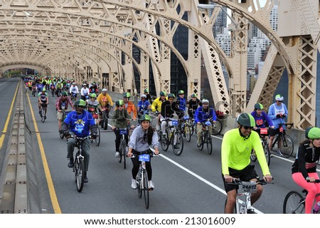 New York City, USA, - May. 4. 2014: people going up Queensboro  Bridge at Five Boro Bike Tour, New York, USA