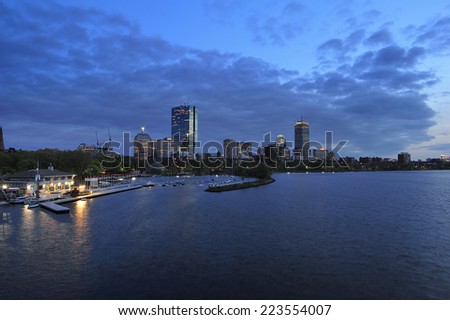 Boston city skyline at dusk with reflection of the skyscrapers over Charles River