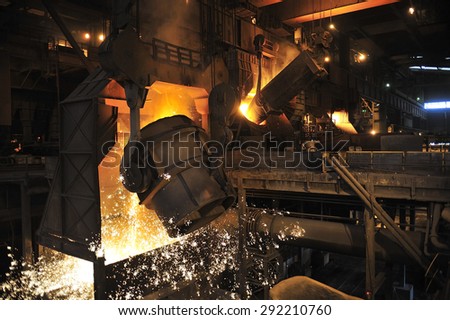 smelting of the metal in the foundry at steel mill