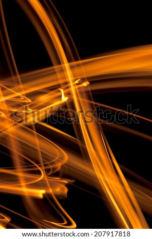 Dance of fire: abstract drawing with using fire on black background