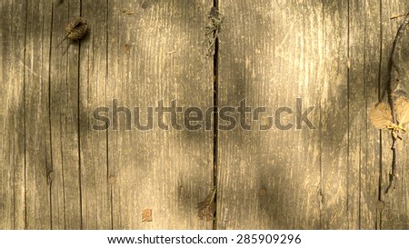 Background texture with old wooden table and yellow leaves