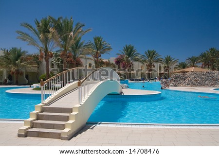 Egyptian hotel swimming pool with bridge