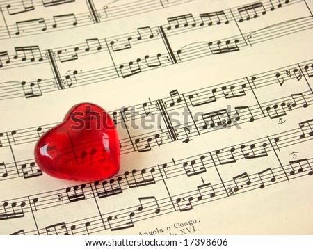 Close up of a music score and a red heart