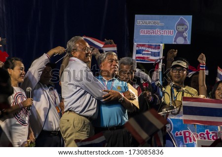 BANGKOK, THAILAND - JAN 24, 2014: Pramote Maiklad (blue shirt), former director-general of Irrigation Department and Suthep Thaugsuban, the PDRC's Secretary-General on the protest stage at Pathumwan.