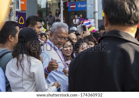 Bangkok, Thailand - Jan19, 2014: Anti-government supporters donate to Suthep Thaugsuban, the PDRCs Secretary-General during the march under the campaign for reform before election.