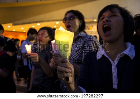 BANGKOK, THAILAND - May 20, 2014: Unidentified demonstrators light candles during a first public demonstrations in the heart of Bangkok on the first day of martial law issued by the military.