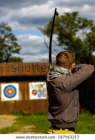 Archer aiming at the target, focused and concentrated \
Objectives / Goals / Success / Aim / Target / Archery / Business / Challenge Background