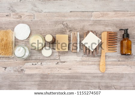 Zero waste bathroom accessories, natural sisal brush, wooden comb, deodorant, shea butter, solid soap and shampoo bars, reusable cotton make up removal pads, make up remover in a glass container.