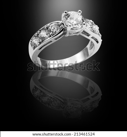 White gold diamond ring on black background