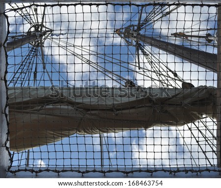 View from the interior of a vessel with mast, rope ladder and surveillance basket