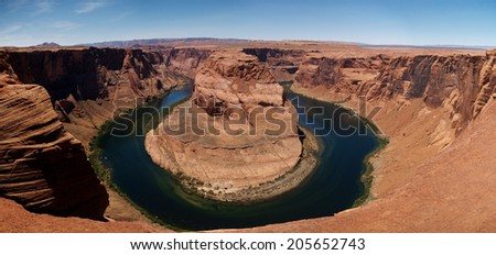 Horseshoe Bend is meander of the Colorado River in its course through the Glen Canyon near Page, Arizona. The canyon rim is almost 1000 feet above the river level at the Horseshoe Bend.