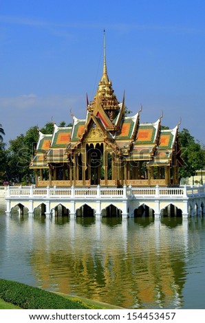 Ayutthaya, Thailand: The Golden Pavilion (Phra Thinang Aisawan Tippaya), a jewel of Thai architecture with  gabled roofs, gilded spire, sits in the middle of a small lake at the Bang Pa-royal palace