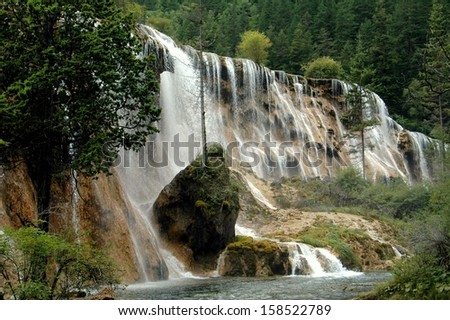 Jiu Zhai Gou, China:  The spectacular Pearl Shoal Waterfall cascading over a bank of rocks at Jiu Zhai Gou National Scenic Park in Sichuan Province, China