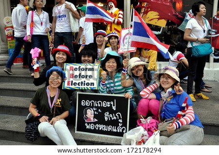Bangkok, Thailand January 13, 2014:  Thais holding political signs during one of the anti-government Operation Shut Down Bangkok demonstrations