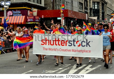 New York, NY - June 30, 2013:  The Shutterstock stock photo agency group marching at the annual Gay Pride Parade on Fifth Avenue