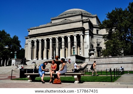 NY - SEP 3, 2009:  Students seated on stone bench in front of the Columbia University library
