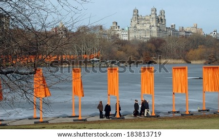 New York, NY - February 15, 2005:  Artist Christo\'s art installation The Gates in line the frozen boating lake in Central Park with the San Remo Apartments in the distance