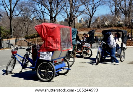 New York City - 1April 2014:  Tourist pedicabs parked at the Cherry Hill viewing point in Central Park on a Spring afternoon