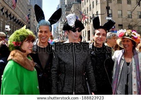 NYC - April 20, 2014:  Group of people including a Lady Gaga impersonator in original holiday creations and bunny ears at the 2014 Easter Parade on Fifth Avenue