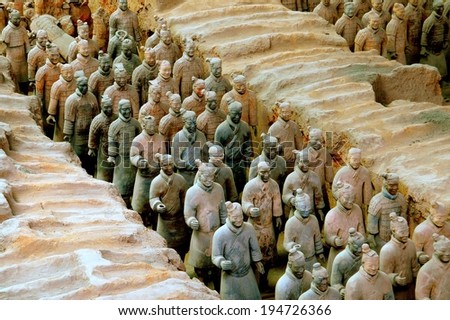 Xi\'an, China - September 7, 2006:  A silent procession of hundreds of soldiers in the Pit #1 excavation site at the Museum of Terra Cotta Warriors of Emperor Qin Shihuang