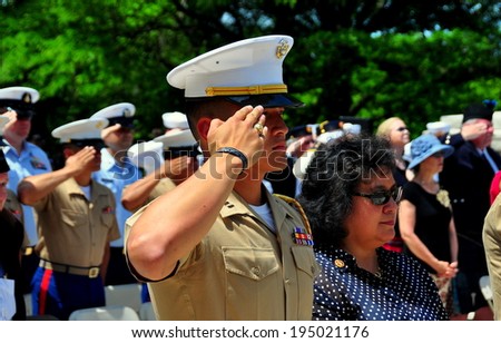 NYC - May 26, 2014:  United States Marine saluting during the annual Memorial Day holiday ceremonies in Riverside Park  *