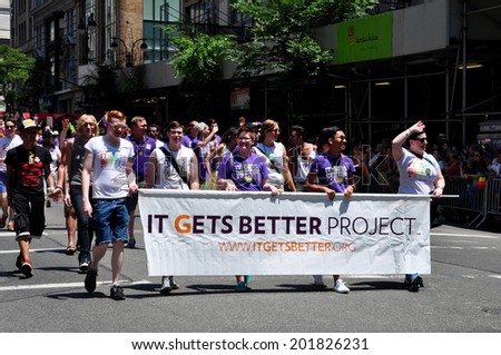 NYC - June 29, 2014:  Group from the It Gets Better Project march behind their banner at the 2014 Gay Pride Parade on Fifth Avenue