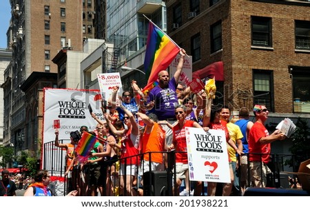 NYC - June 29, 2014:  Riders on the Whole Foods / God\'s Love We Deliver float at the 2014 Gay Pride Parade on Fifth Avenue