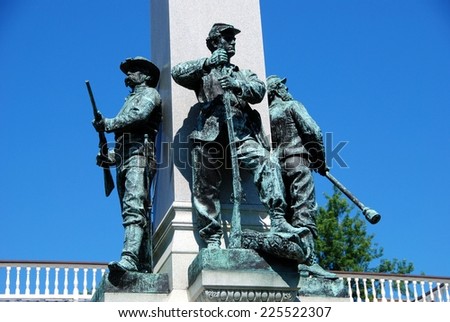 Yonkers, NY:  Civil War soldier statues with their weapons stand at the base of the Yonkers 1892 Civil War Memorial