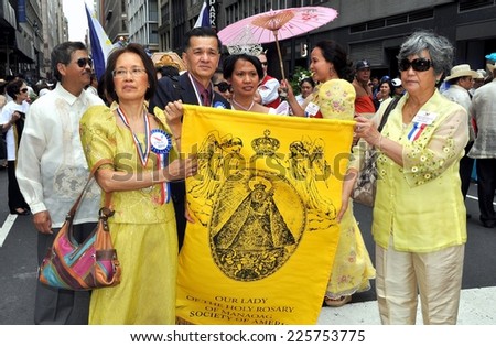 NYC - June 4, 2011:  Group of Filippinos from Our Lady of the Holy Rosary Church with their banner at the 2011 Philippines Independence Day Parade