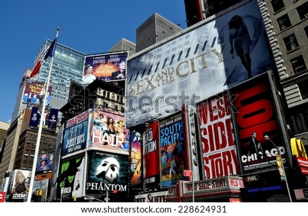 NYC - May 5, 5010:  Advertising covers the sides of buildings promoting Broadway musicals and films in Times Square at West 46th Street