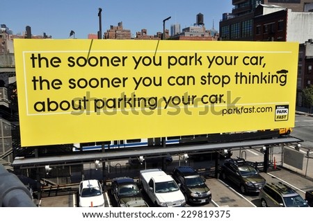 New York City - August 27, 2010:  Amusing Park Fast parking lot sign seen from the High Line Park at West 17th Street and 10th Avenue