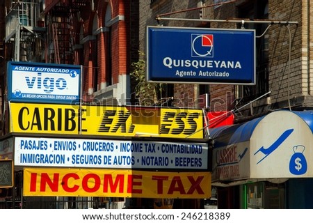 New York City - September 6, 2004: Signs in both English and Spanish offer legal and accounting services in Spanish Harlem