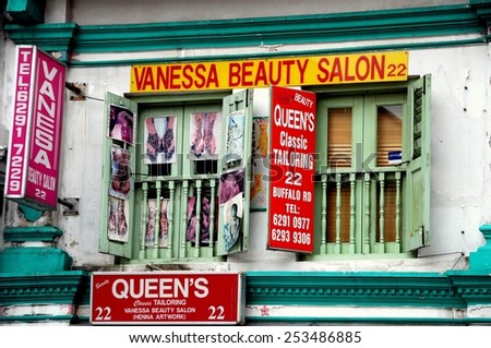 Singapore - December 17, 2007: Two Indian businesses, a beauty salon and tailor, occupy a shop house on Buffalo Road in Little India