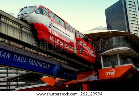 Kuala Lumpur, Malaysia - January 1, 2008:   KL Rapid Transit System Monorail train leaving Bukit Nanas station