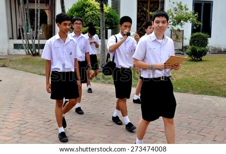 Bangkok, Thailand - January 19, 2011:  Thai teen-aged students in their regulation shorts and white shirts uniforms on a school trip to the National Museum
