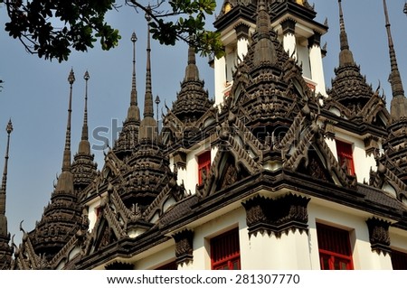 Bangkok, Thailand - December 17, 2012:  Loha Prasat, the Iron Castle, decorative roof finials at Wat Ratchanadda