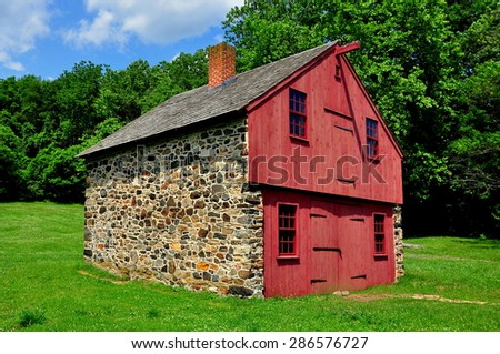 Chadds Ford, Pennsylvania - June 8, 2015:  Fieldstone and wooden work shed at the Gideon Gilpin House in the historic Revolutionary War Brandywine Battlefield Historic Park  *