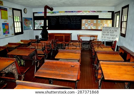 Lancaster, Pennsylvania - June 5, 2015:  Student desks in graduated sizes inside the one room Amish schoolhouse at the Amish Village outdoor museum
