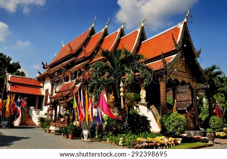 Chiang Mai,Thailand - December 23, 2012:  Wat Ket Karam with five interlocked gabled orange tiled roofs, each with a gilded chofah ornament, is a fine example of northern Lanna temple architecture  *