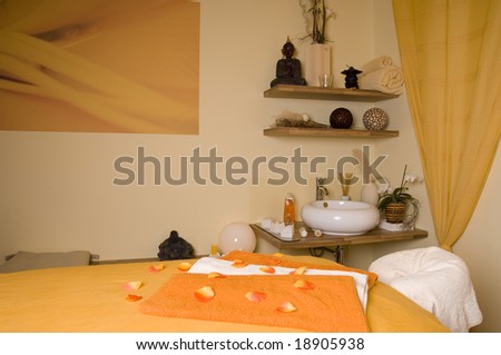 Inside a spa room with a lot of essential utensils as a wide angle horizontal image